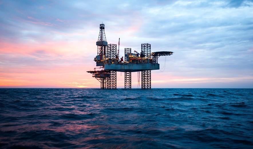 Oil rig at sunset in the ocean